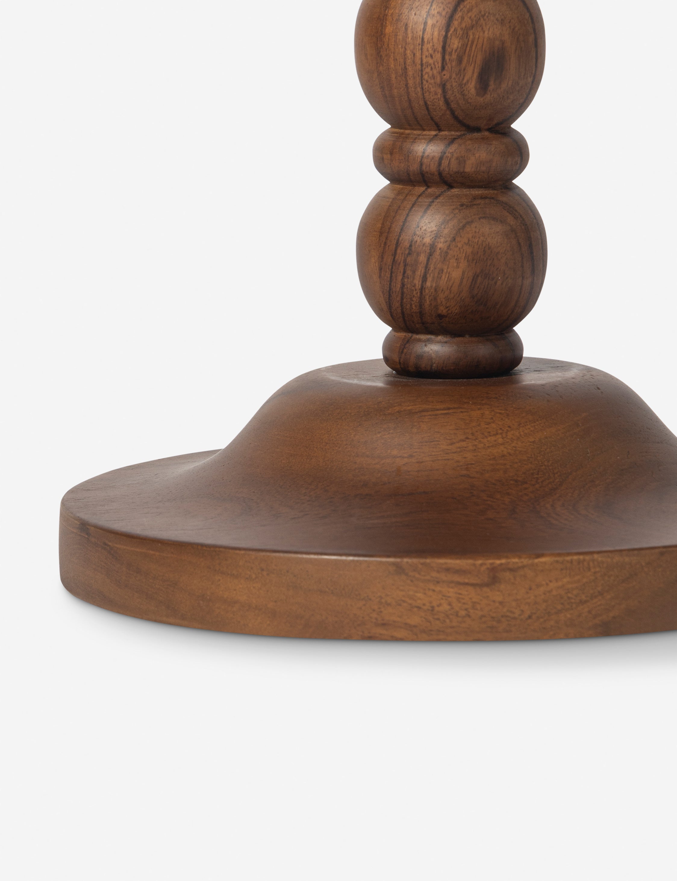 Close up of the base of the Foxton beaded turned wood round drink side table