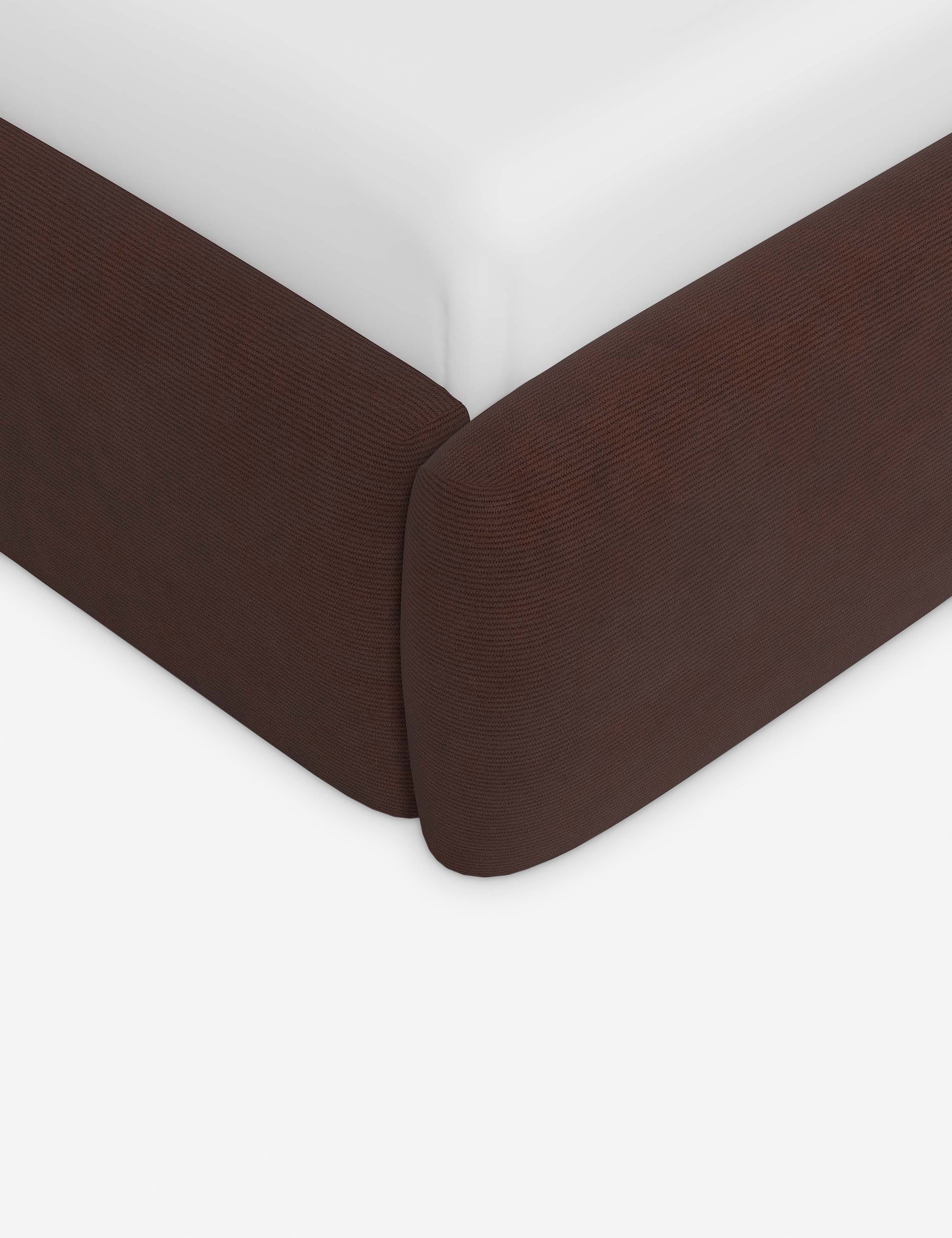 Corner of the Gladys extended headboard upholstered platform bed in wine corduroy