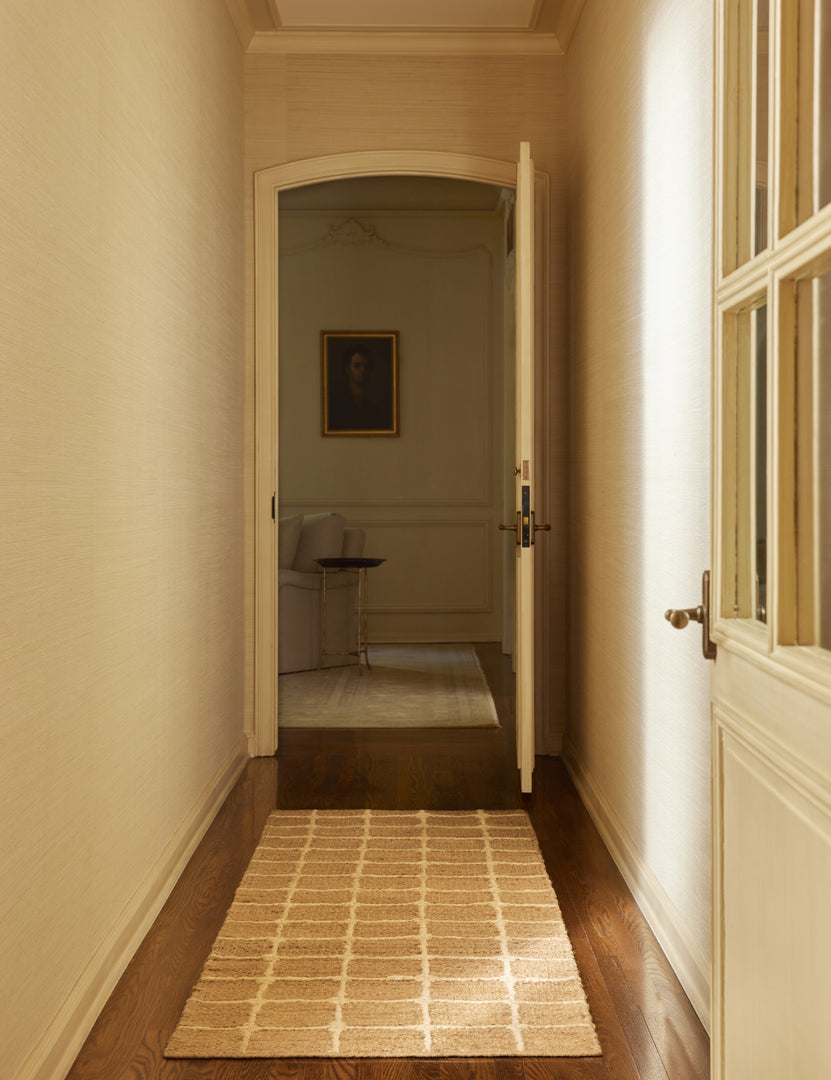 #color::natural #size::2-6--x-8--runner | A hallway featuring the Beddow Flatweave Jute Grid Rug by Jake Arnold in the runner size.