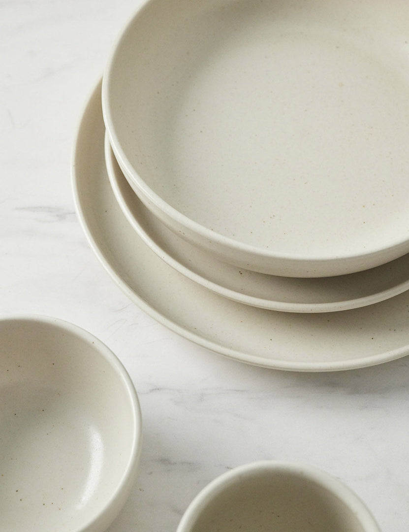 #color::vanilla #style::5-piece-set | Angled view of the Pacifica Vanilla-toned Dinnerware 5-Piece Place Setting by Casafina