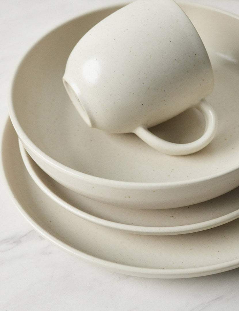 #color::vanilla #style::5-piece-set | Angled view of the Pacifica Vanilla-toned Dinnerware 5-Piece Place Setting by Casafina