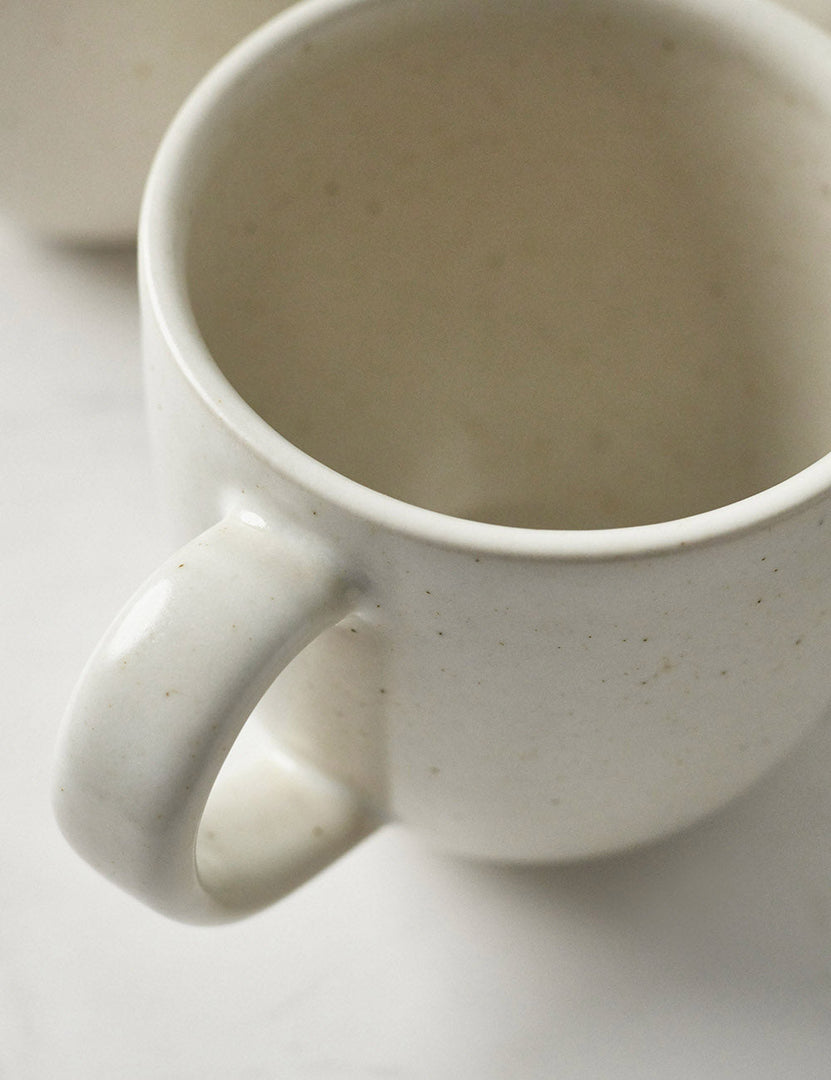 #color::vanilla #style::5-piece-set | Close-up of the mug in the Pacifica Vanilla-toned Dinnerware 5-Piece Place Setting by Casafina