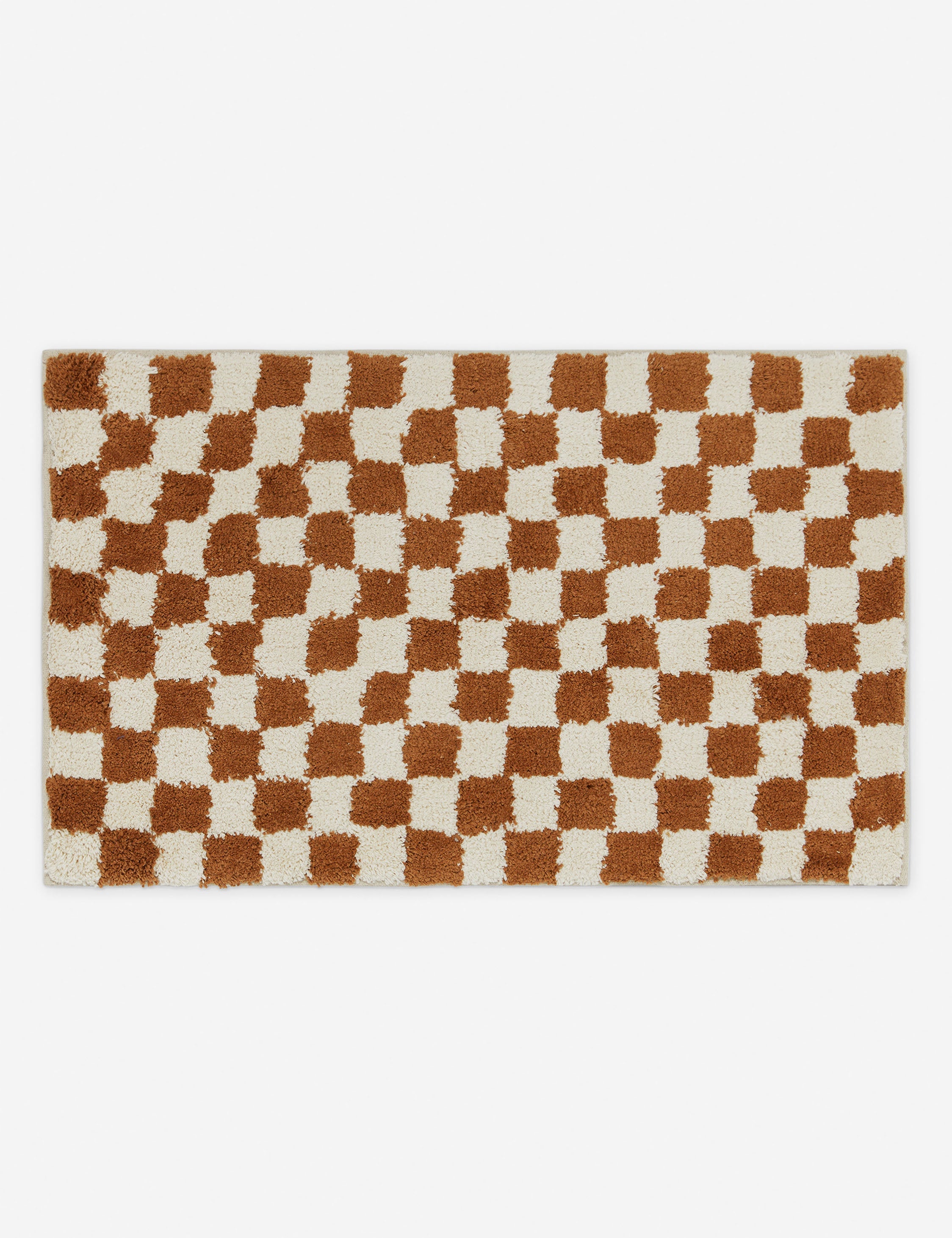 Two-tone checkerboard bath mat by Sarah Sherman in rust umber