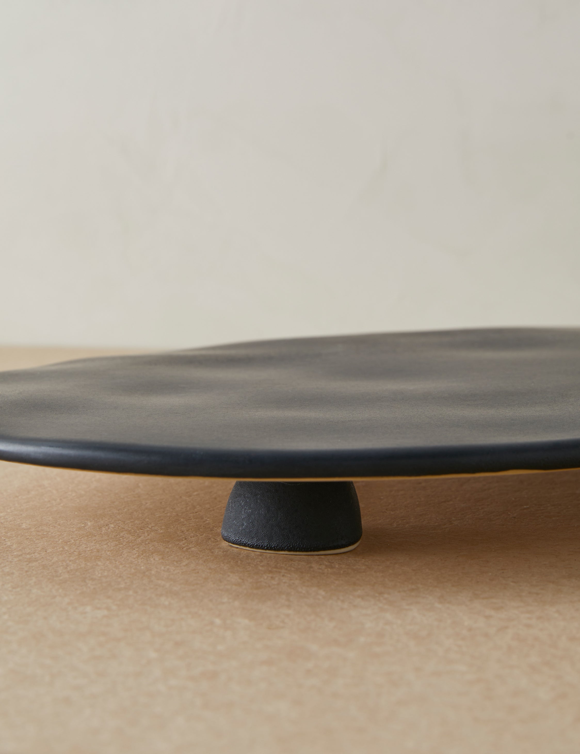 Close up of the Footed serving display tray in black