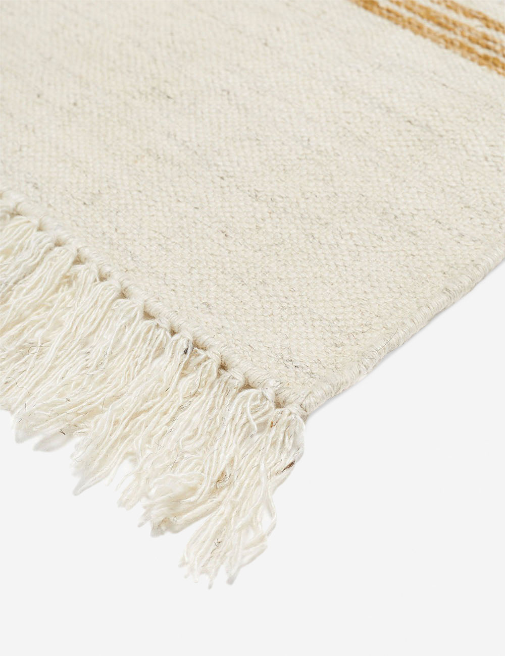 The fringed corner of the Iconic Stripe Rug