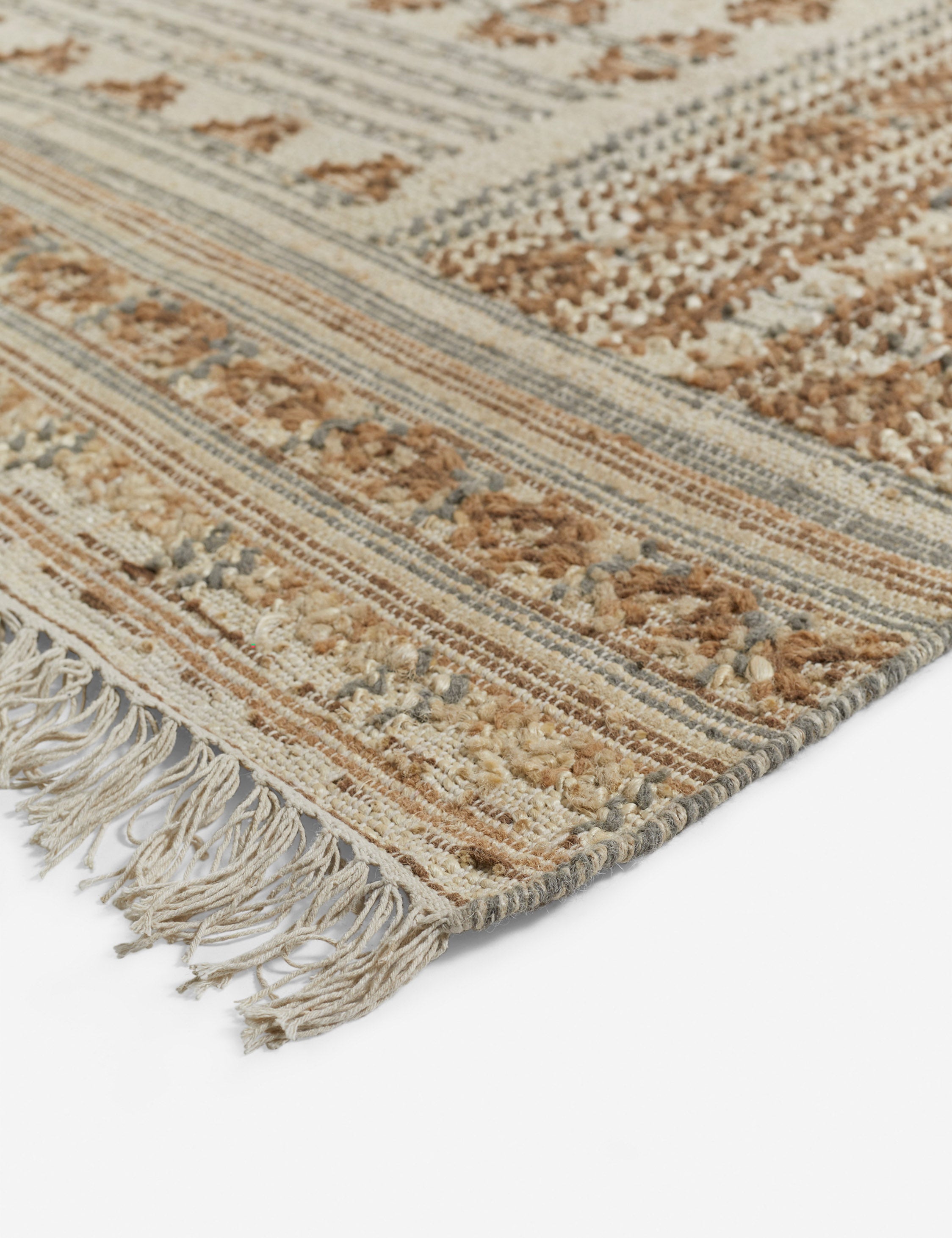Fringed corner of the Keziah slate rug