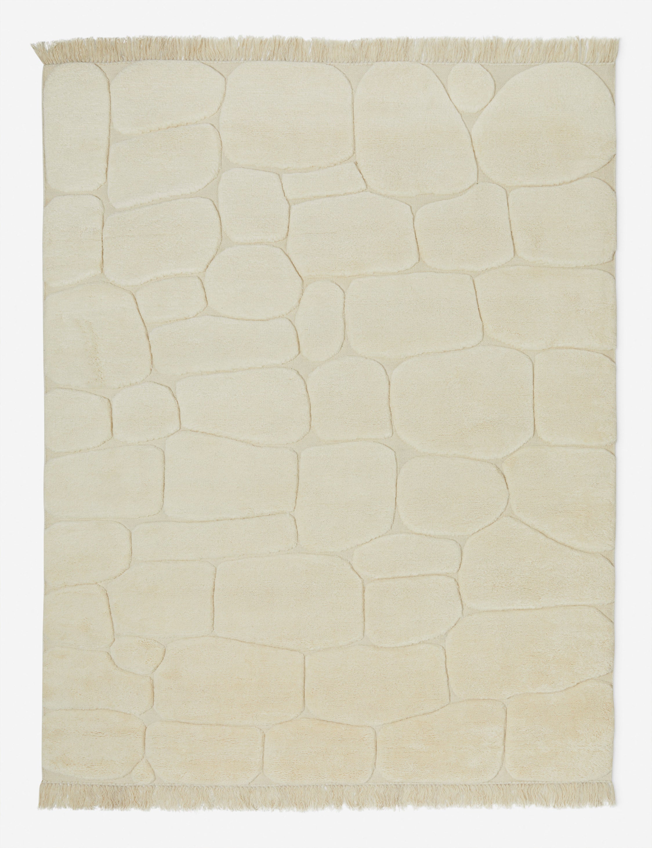 Kivi raised cobblestone pattern fringe wool area rug