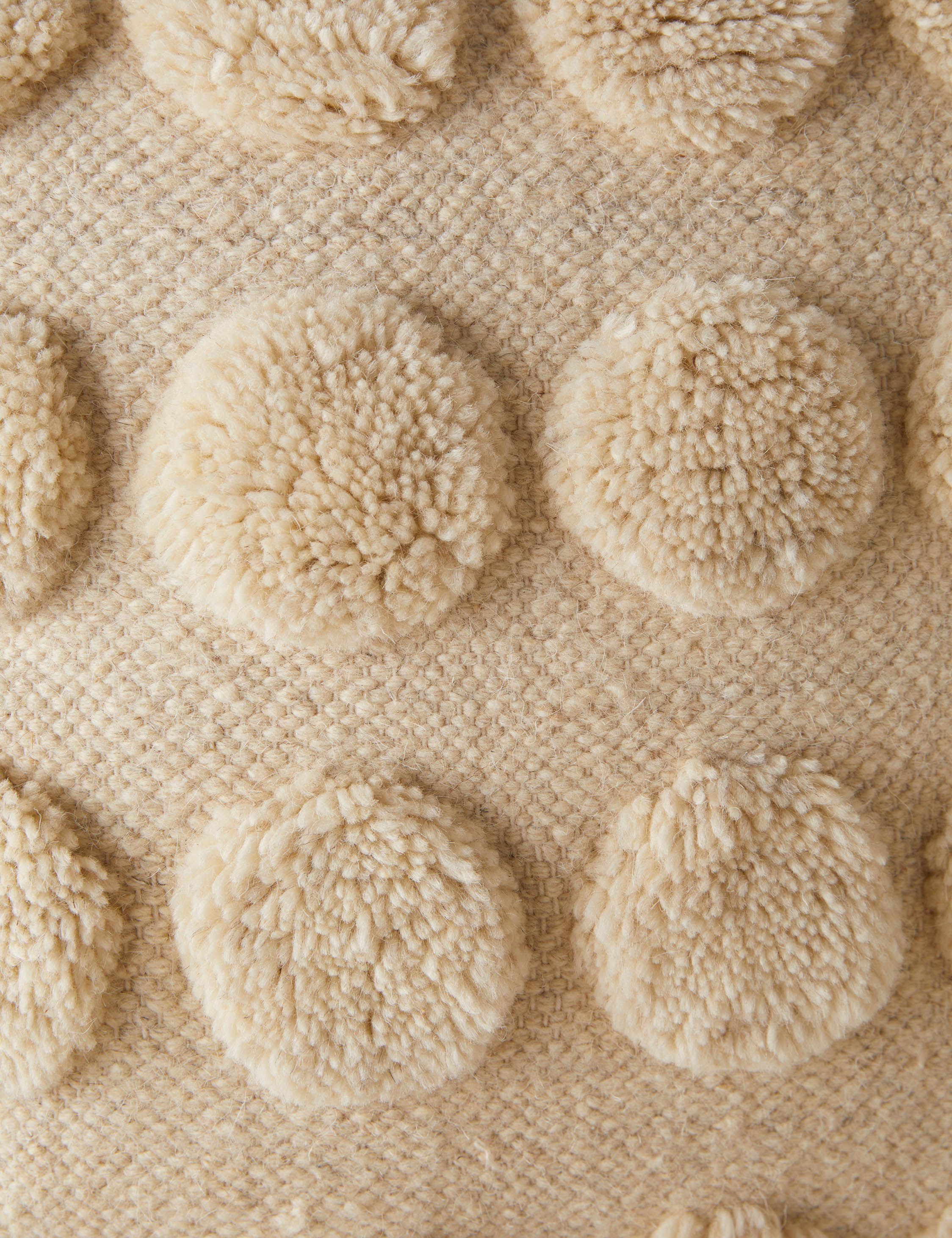 Close up of the tufted dot pattern of the Kohta pillow