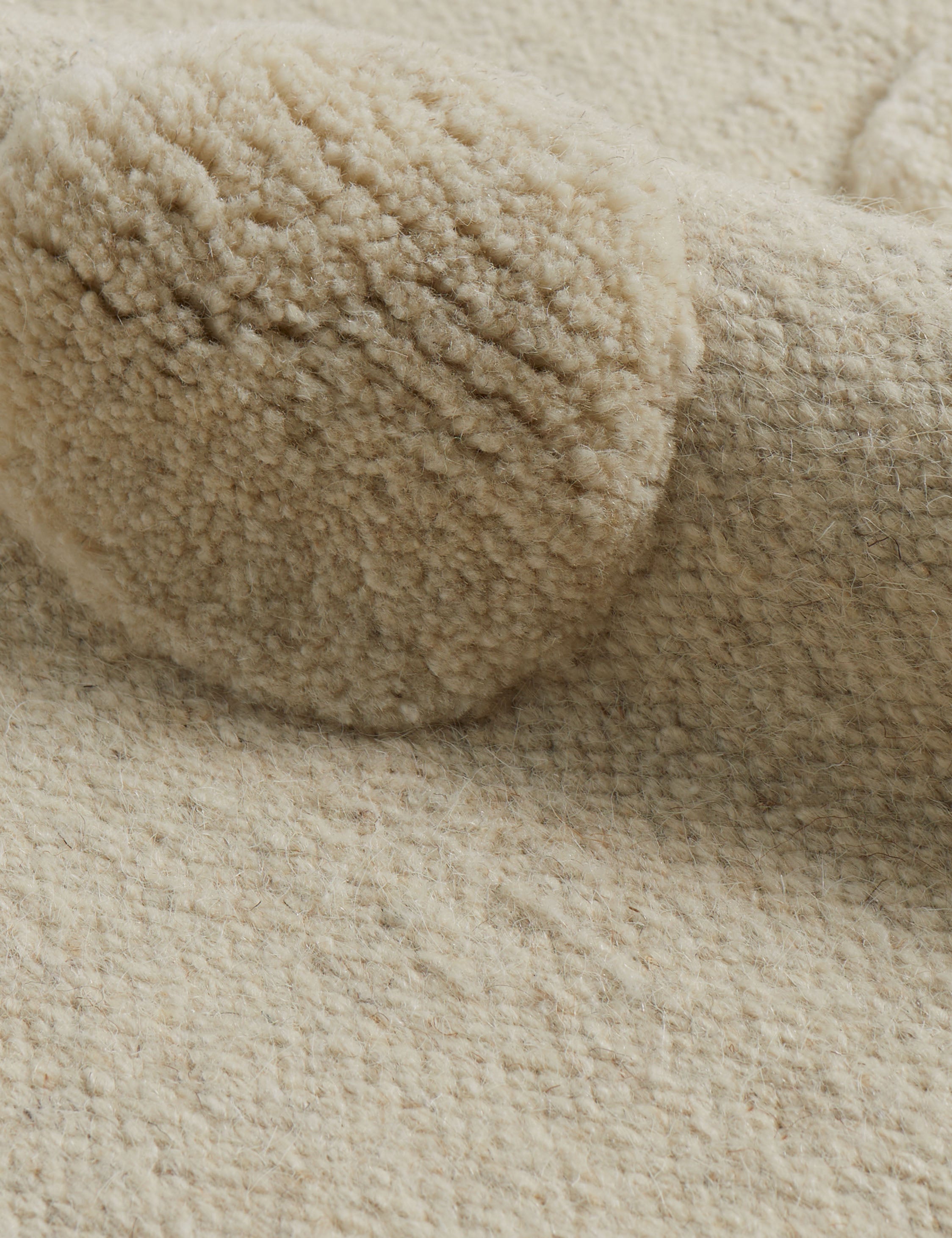 Kohta high-low pile dot design wool area rug in ivory