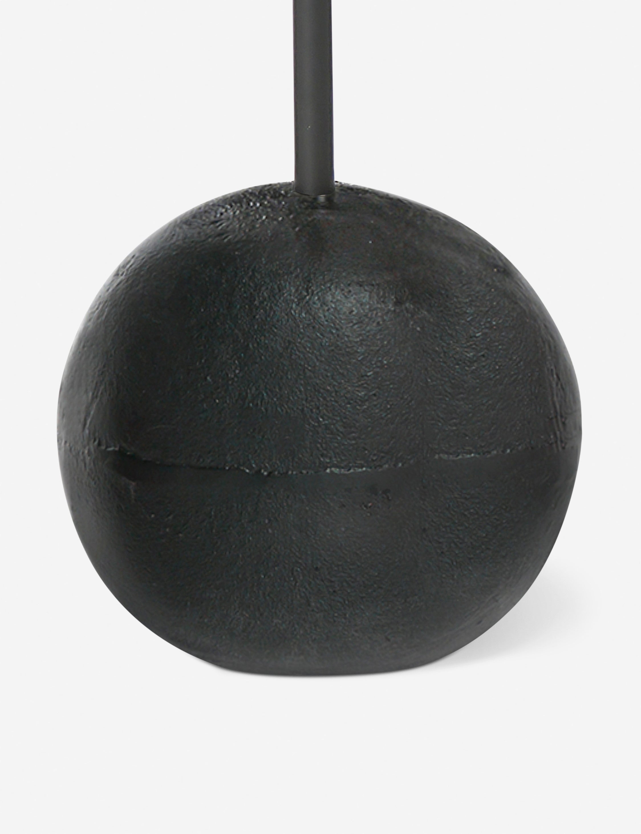 Close up of the base of the Olinda slim, spherical base round drink table