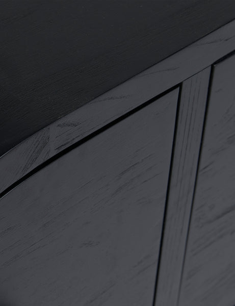#color::black | Close up of the Laughlin retro pill shaped sideboard cabinet in black