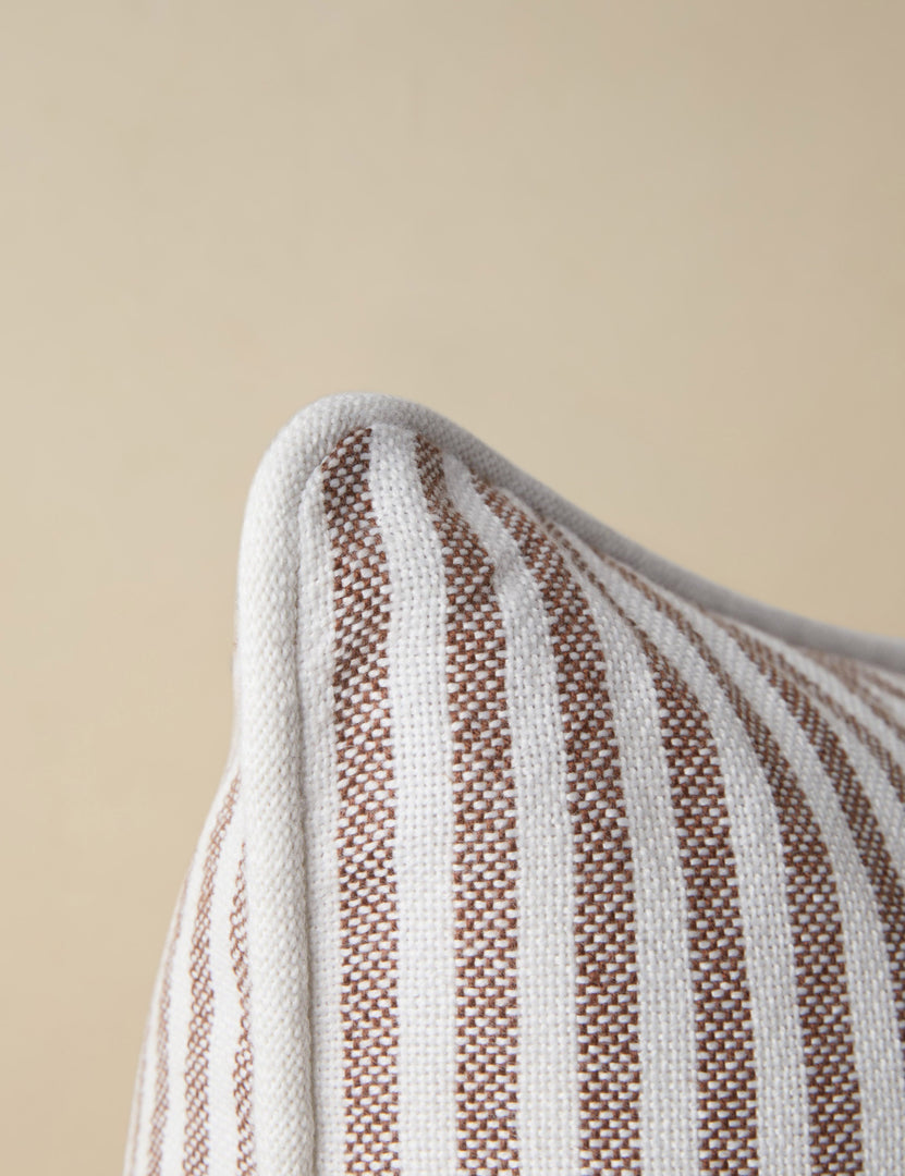 #color::brown | Close up of the corner of the Littu Indoor / Outdoor Striped Throw Pillow by Sarah Sherman