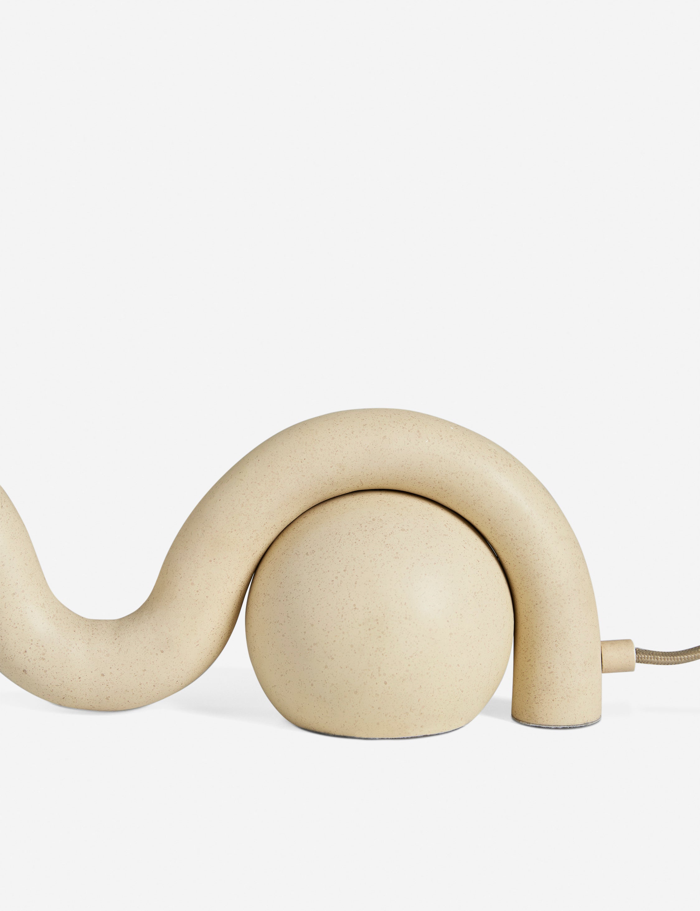 Close up of the Noor sculptural, wavy table lamp