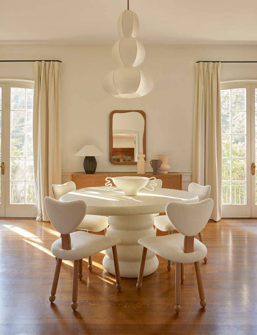 #color::ivory | Dining room featuring the Hannu modern round fibercement dining table by Aimee Song