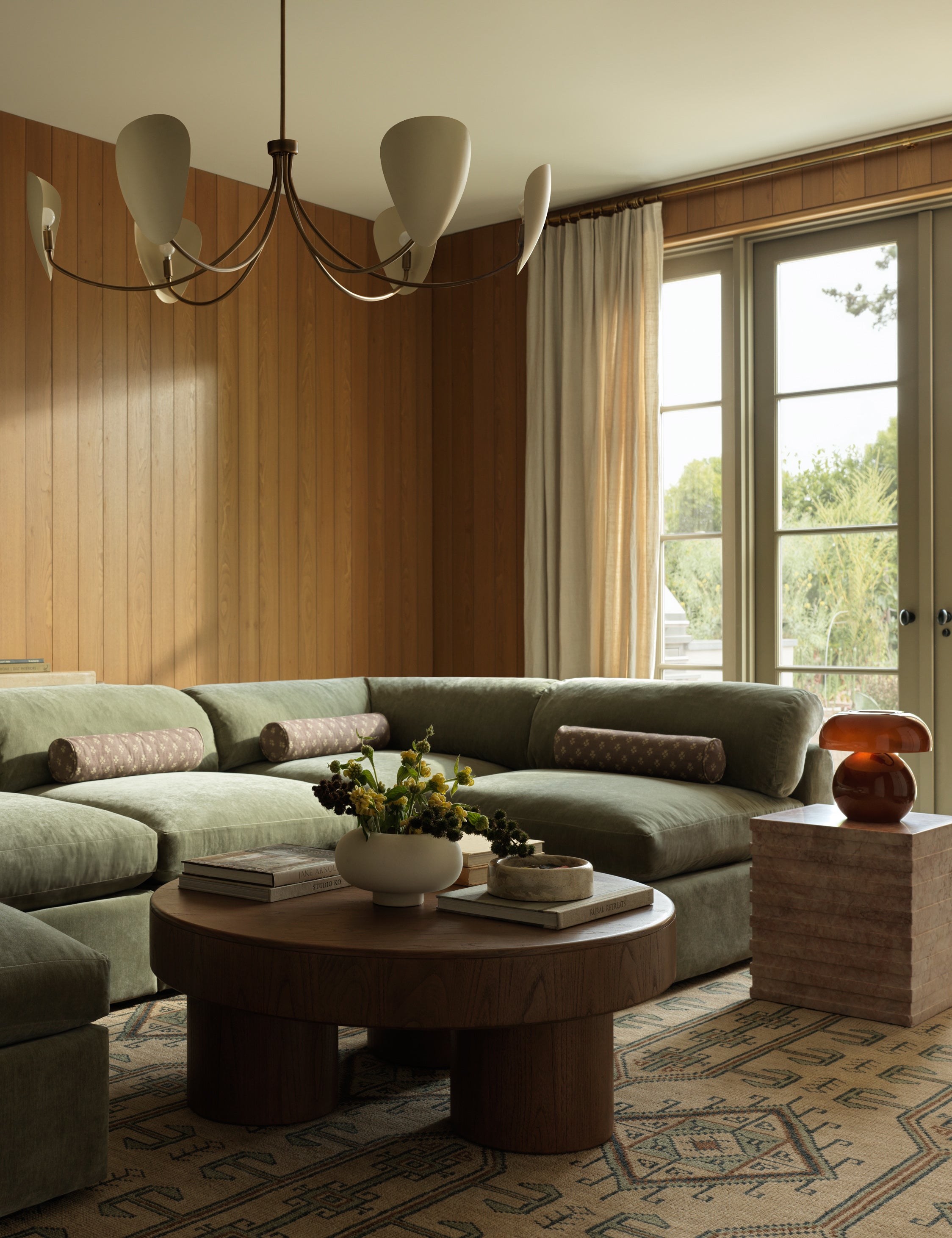 A living room featuring the Vishal geometric motif hand-knotted wool rug.