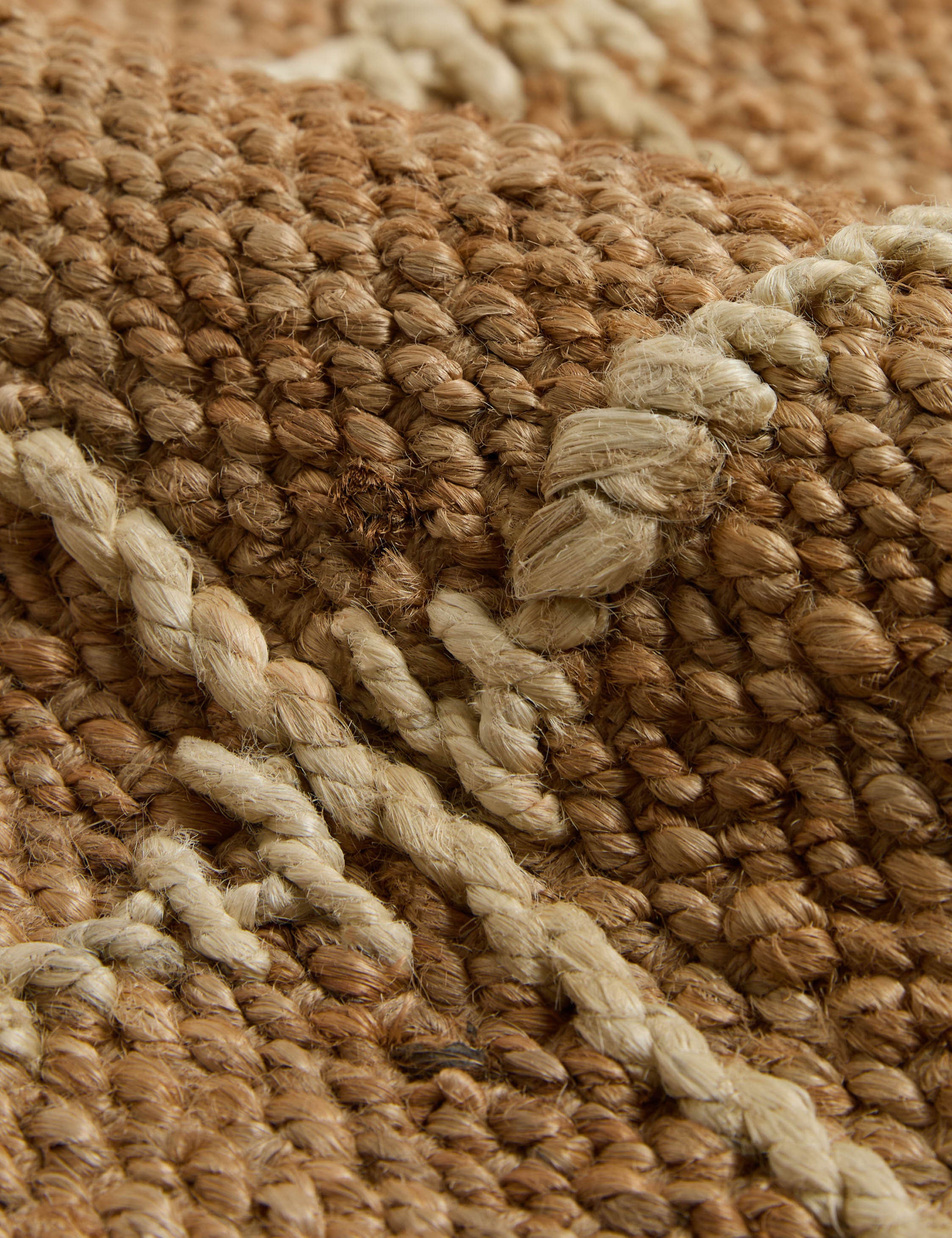 Close up of the weave of the Beddow Flatweave Jute Grid Rug by Jake Arnold.
