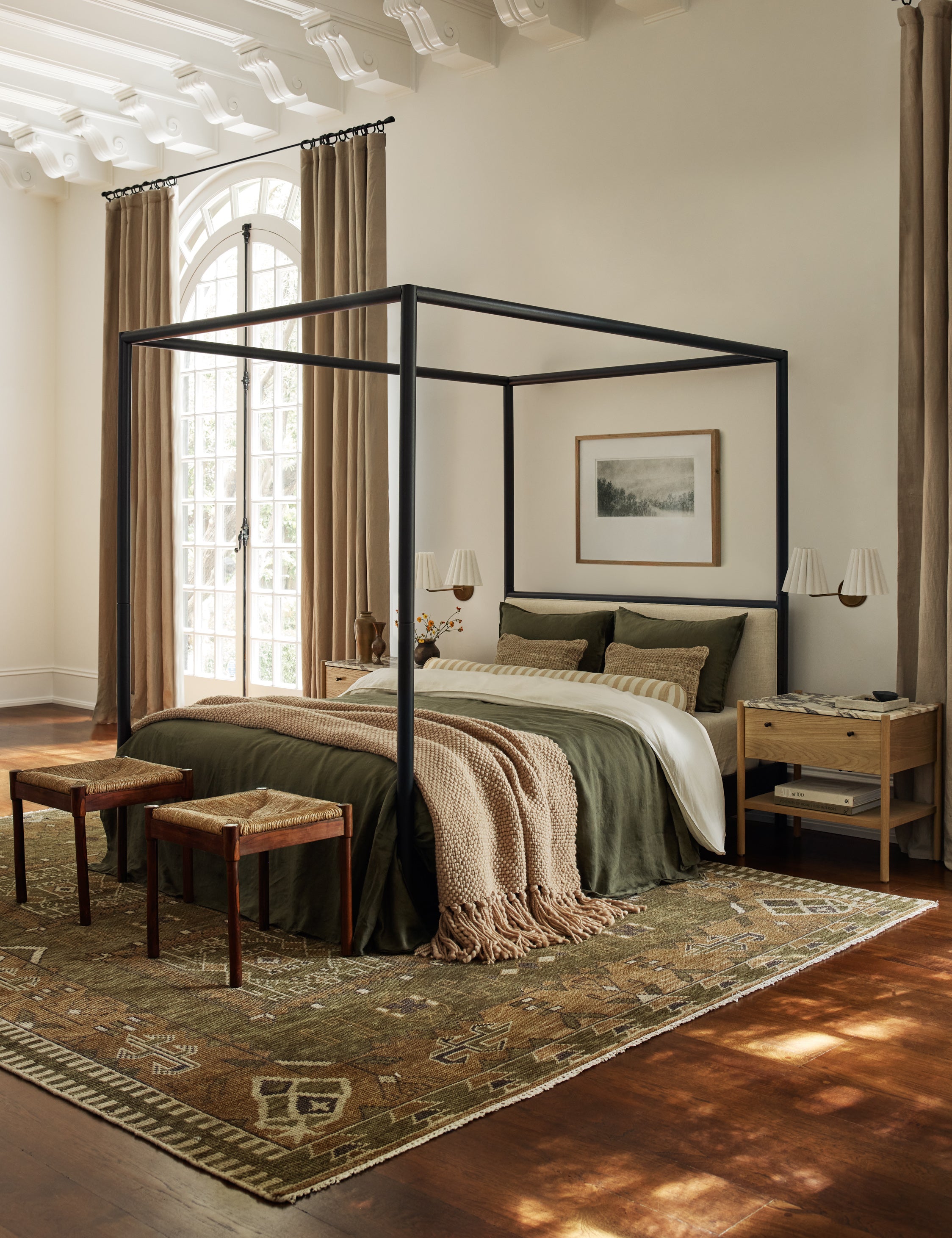Bedroom featuring Simonette black canopy bed with upholstered headboard