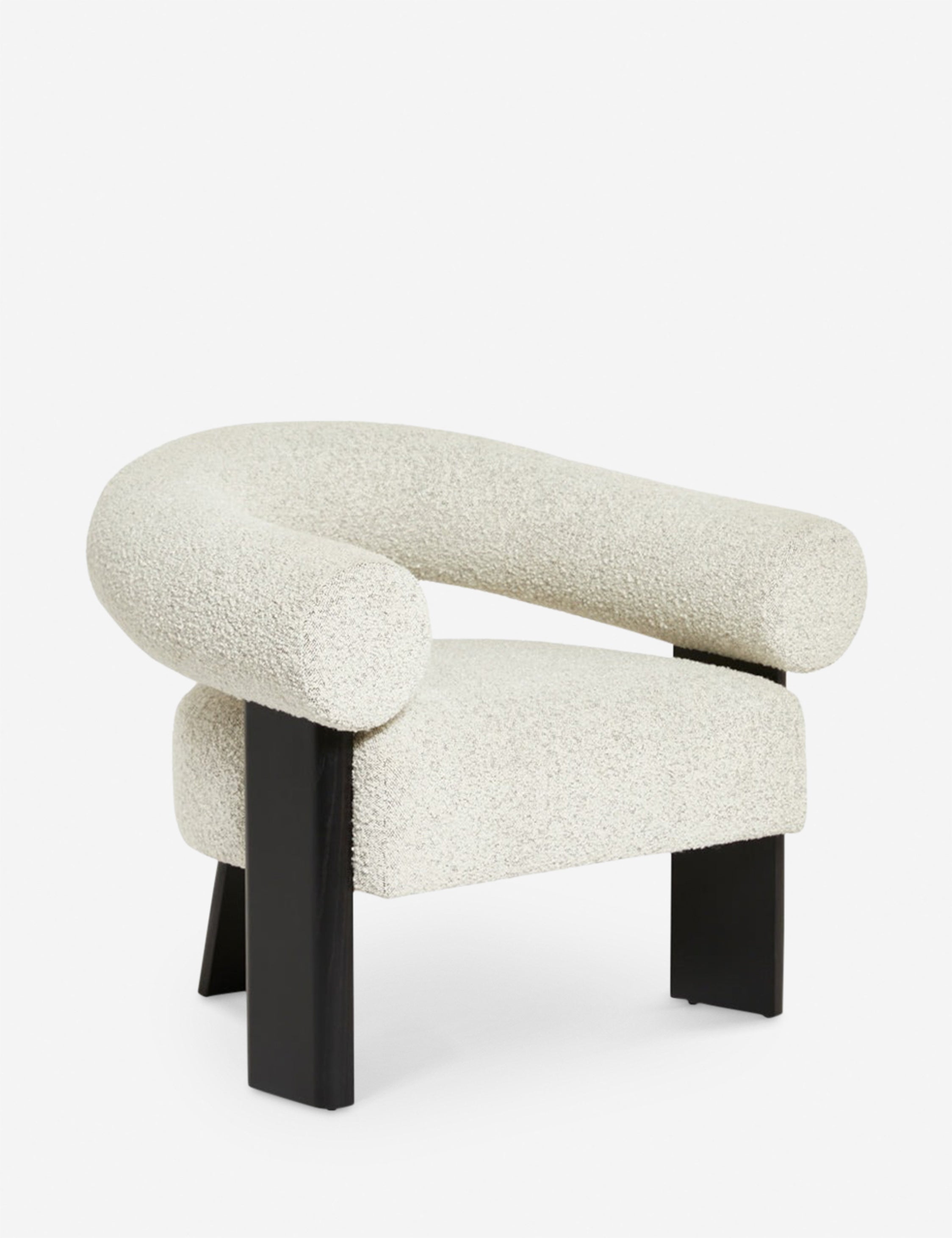 Angled view of the Celeste black wood accent chair with wishbone frame