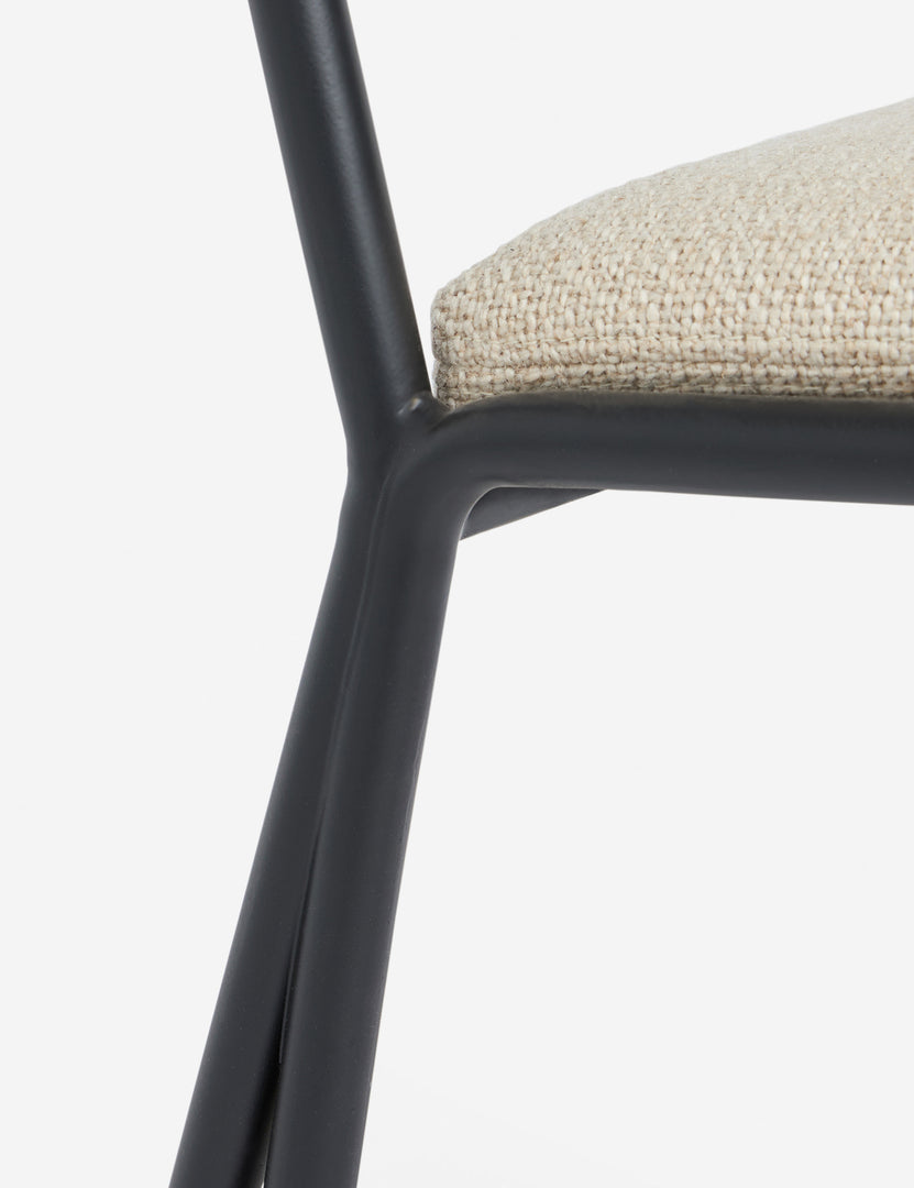 #color::taupe-basketweave | Close up of the Fidia curved metal silhouette dining chair by Aimee Song