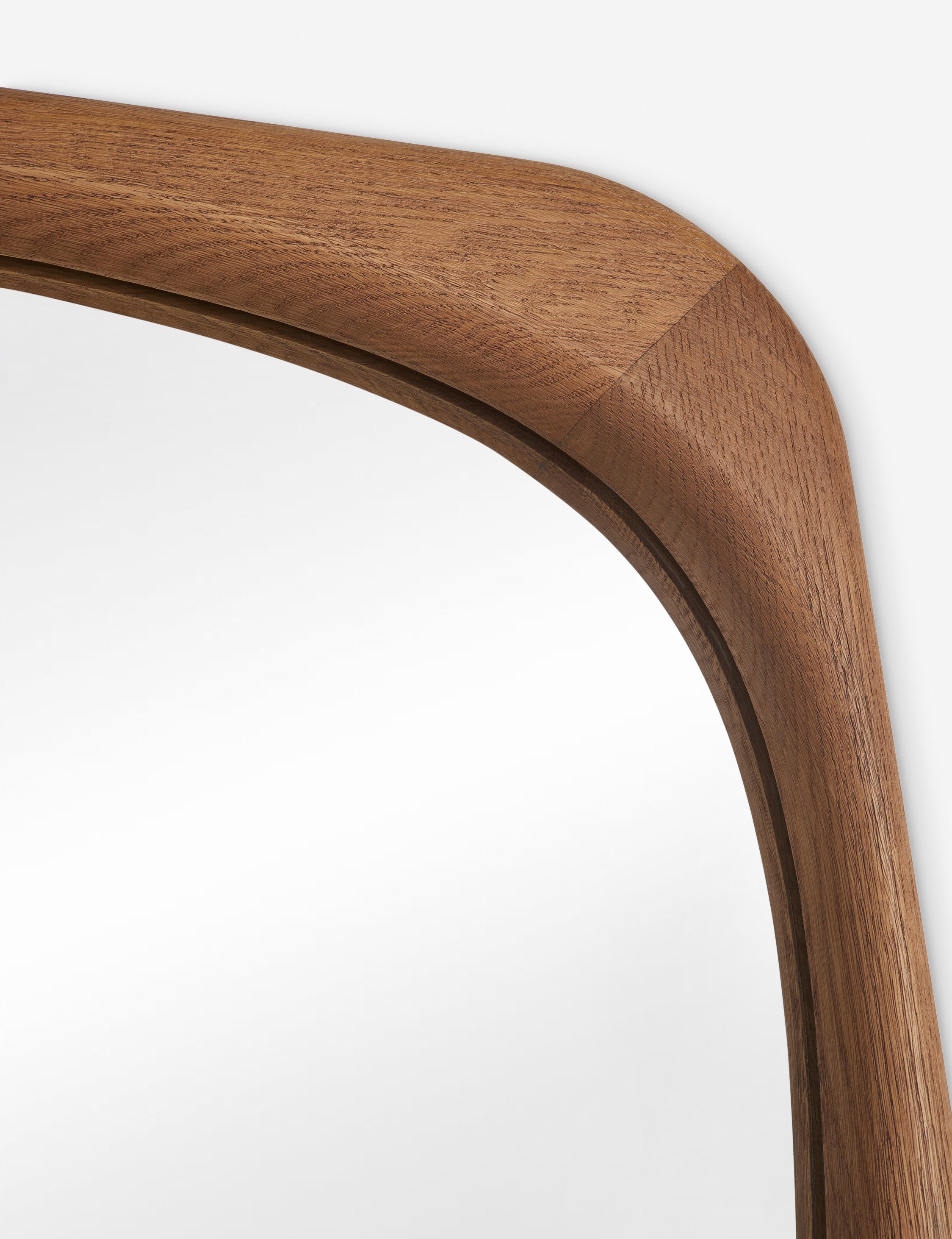 Close up view of the frame of the Galilea solid wavy wood frame floor mirror mirror by Aimee Song