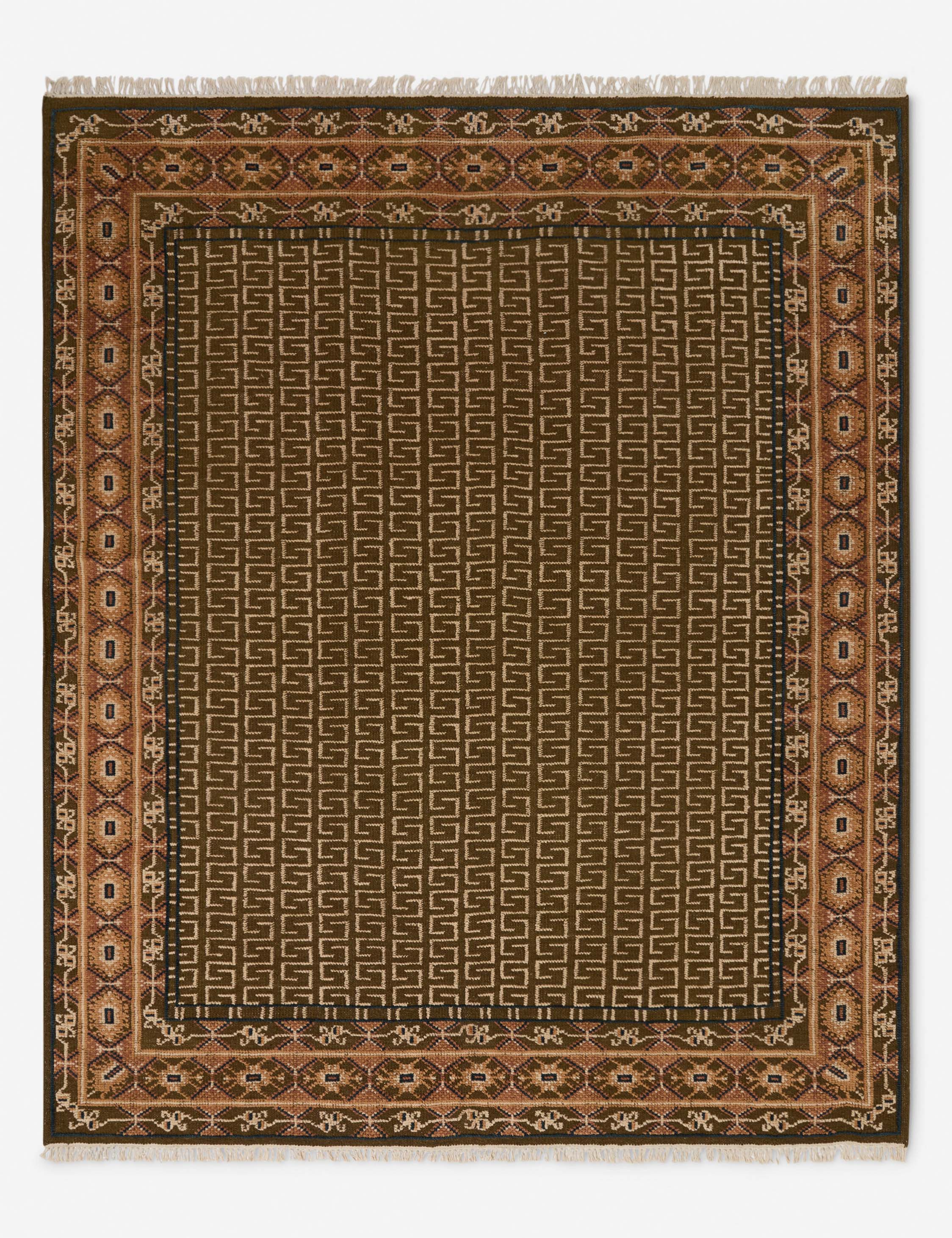 Manca traditional geometric motif hand-knotted wool rug.