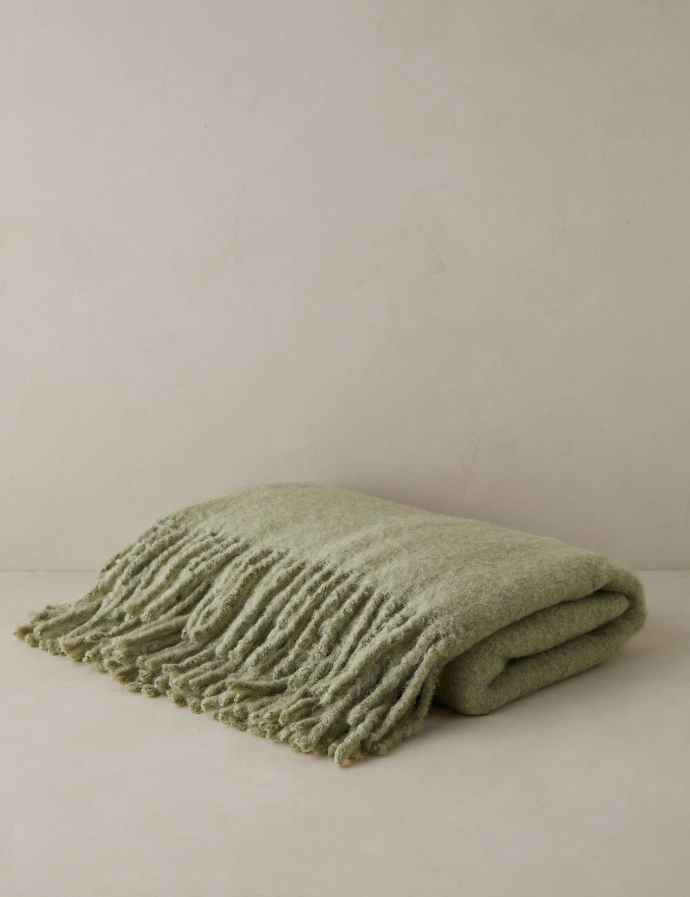 Snug faux mohair throw blanket in lichen green