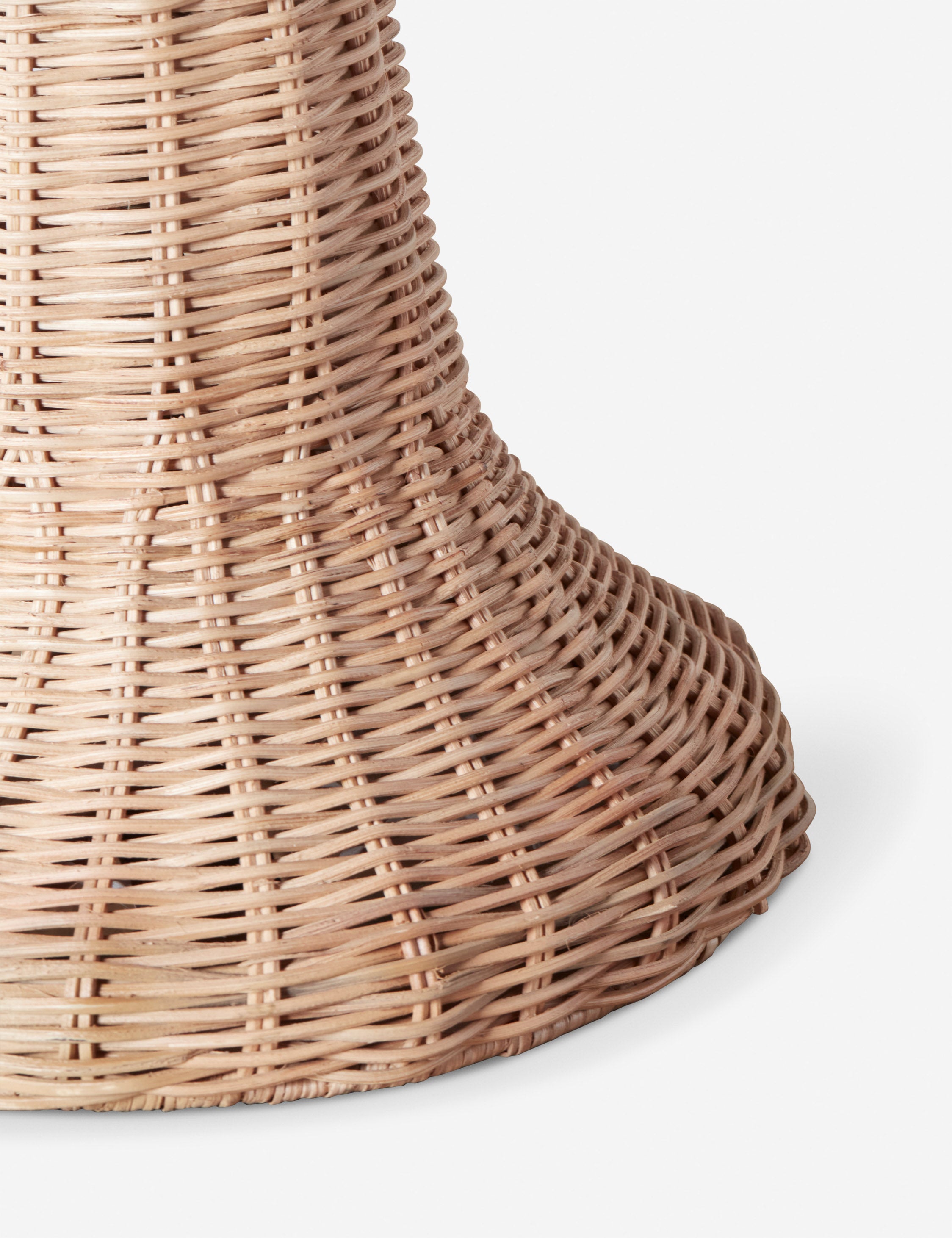 Close up of the base of the Quinley dome rattan coast table lamp.