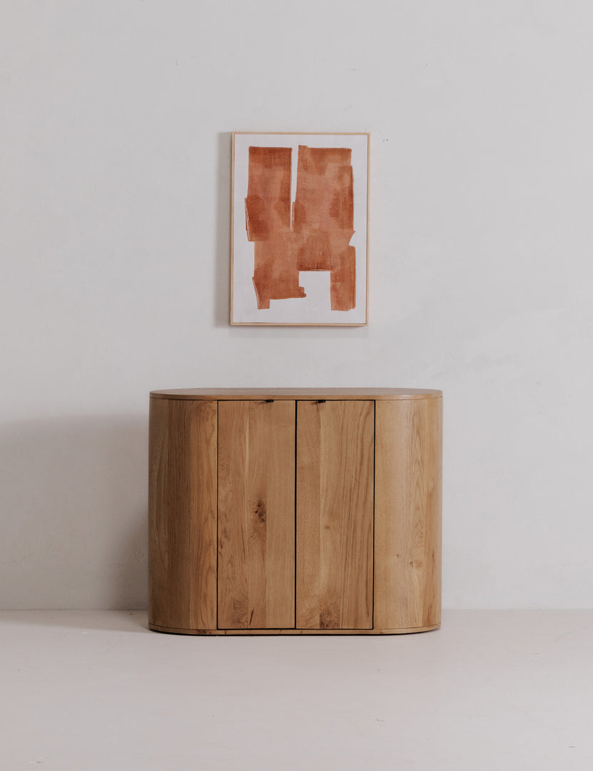 | Kono 2-door curved oak cabinet.