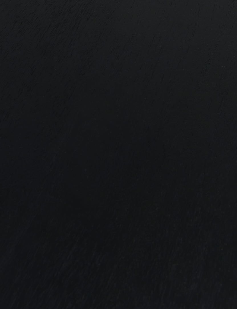 #color::black | Close up of the wood grain of the Mojave round dining table in black.