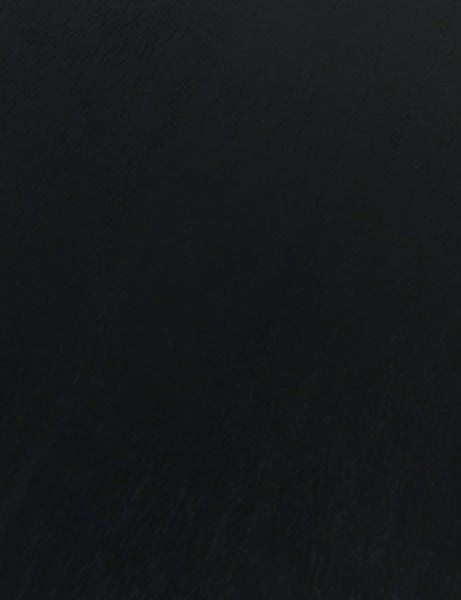 #color::black | Close up of the wood grain of the Mojave round dining table in black.