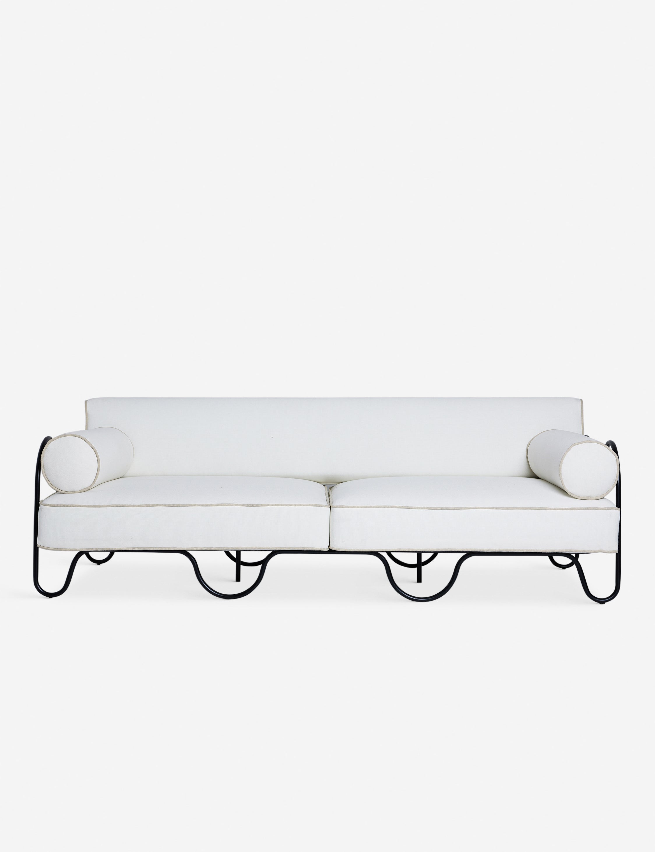 Peggy sculptural iron frame and white cushion outdoor sofa.
