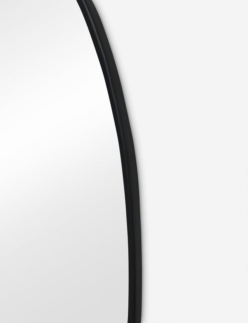 #color::black #size::large | Close up view of the Puddle slim frame wall mirror in charcoal