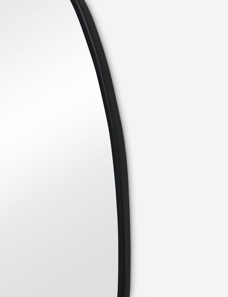 #color::black #size::large | Close up view of the Puddle slim frame wall mirror in charcoal