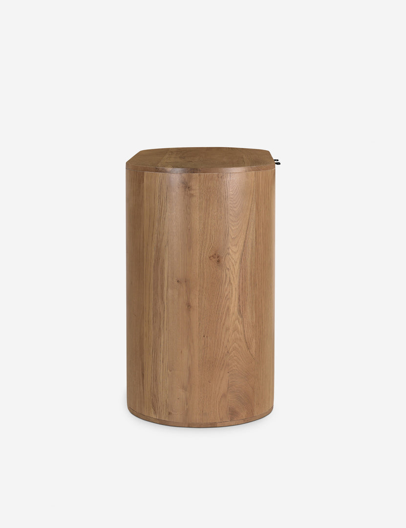 | Side view of the Kono 2-door curved oak cabinet.