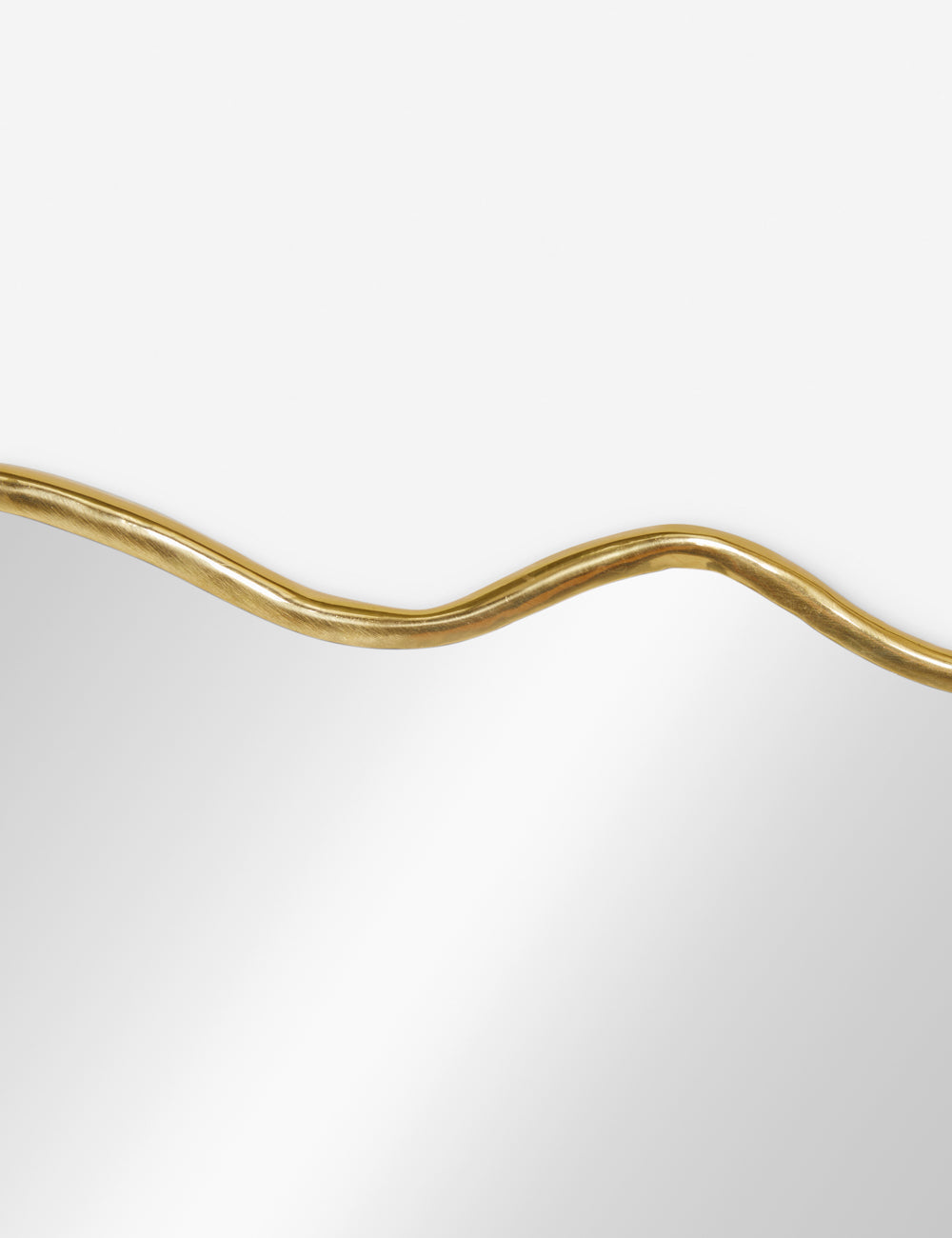 The wavy silhouette on the top of the rook mantel mirror