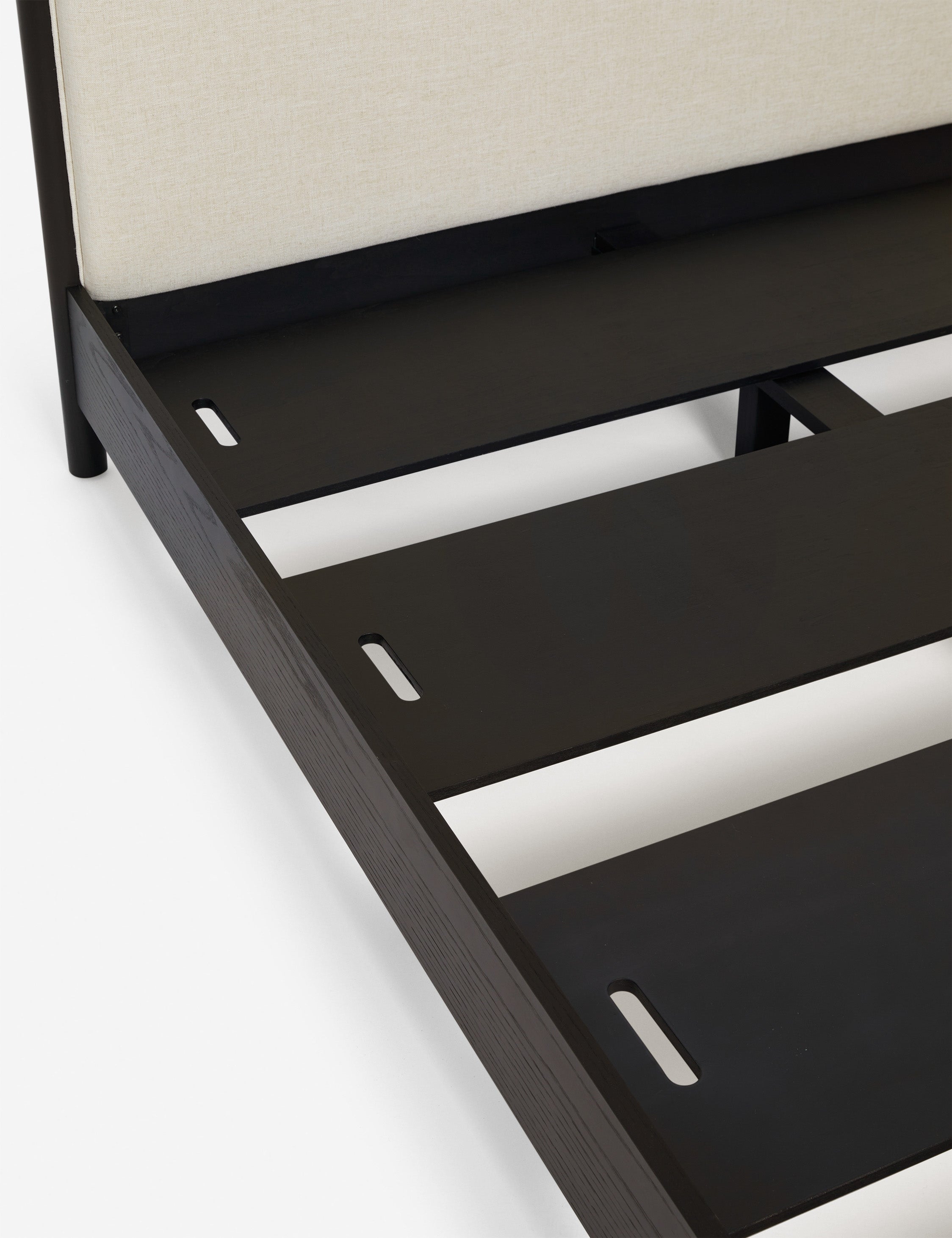 Close up view of Simonette canopy bed slatted base