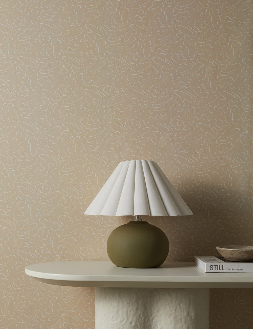 #color::natural | Topos Abstract Line Patterned Wallpaper by Élan Byrd on a wall behind a console table styled with a small table lamp.