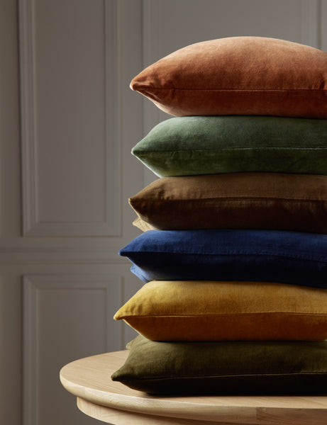 #color::burnt-orange #style::square  #fill type::with-feather-down-insert  #fill type::pillow-cover-only |   Charlotte velvet pillow in olive green, mustard, true blue, toast, moss, and burnt orange are stacked atop each other