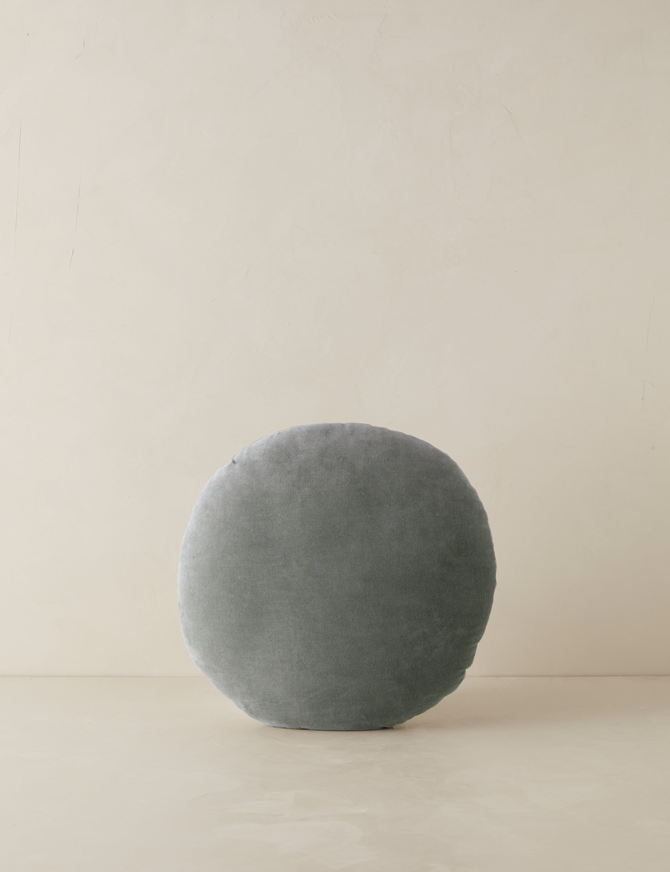 Velvet round accent pillow in lichen