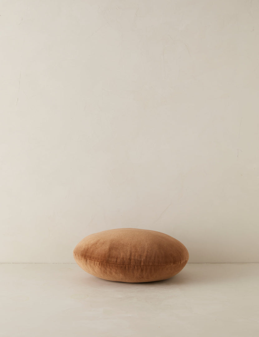 #color::umber | Velvet round accent pillow in rust umber laying flat