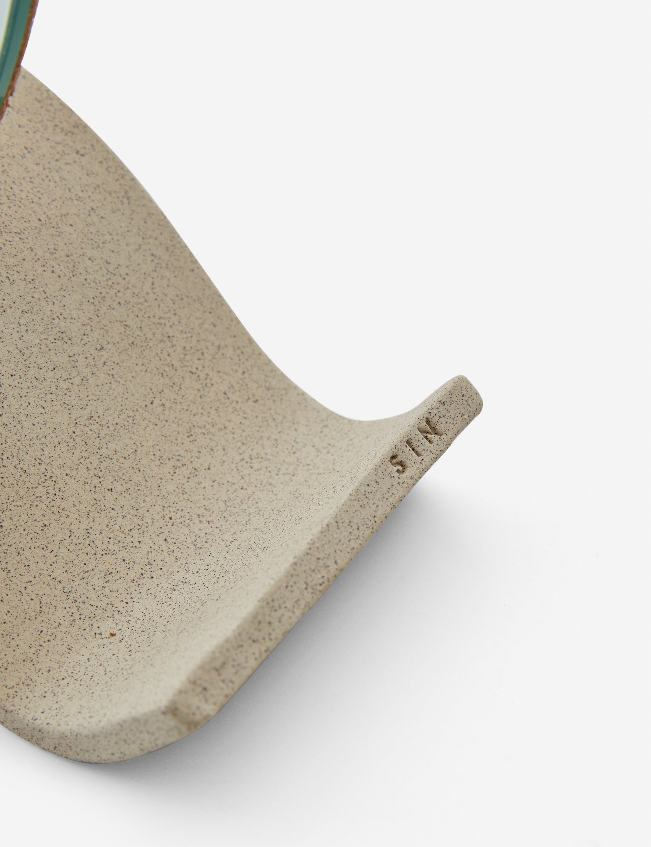Close up view of the round Wavee Table Mirror by SIN Ceramics