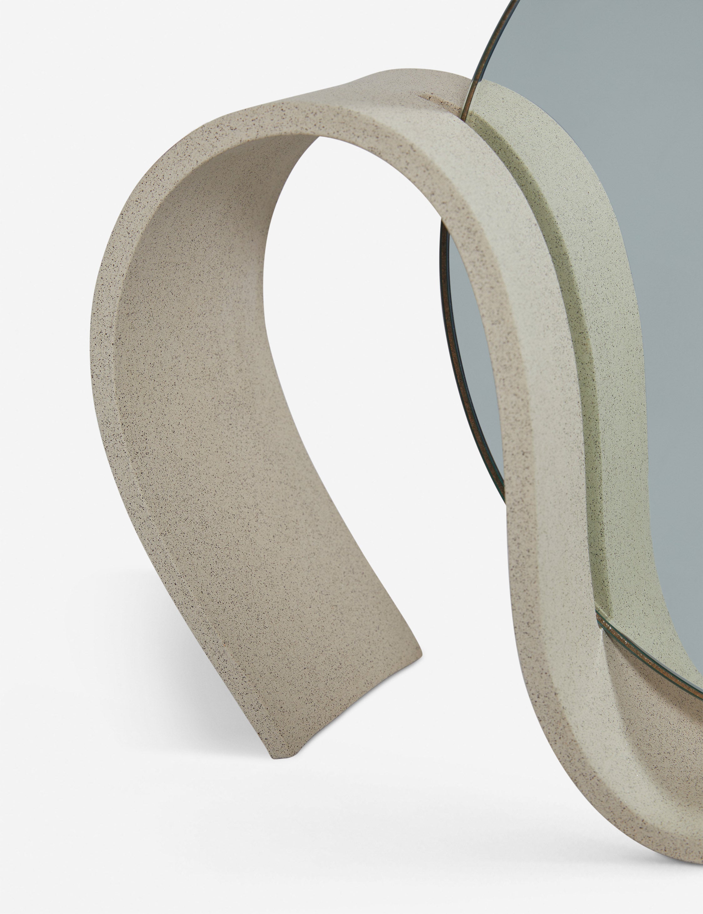 Close up view of the round Wavee Table Mirror by SIN Ceramics