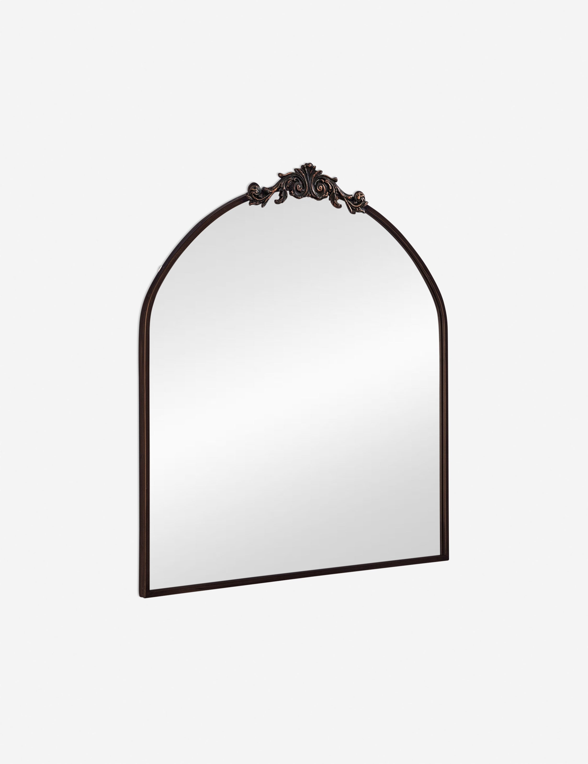 Angled view of the Tulca arched oil rubbed bronze mirror with flat bottom edge and traditional scroll detailing.