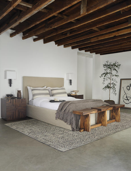#showall::39490242052195 | The Paxton flax linen slipcover bed sits in a room with wooden-beamed ceilings in between two accented wooden nightstands