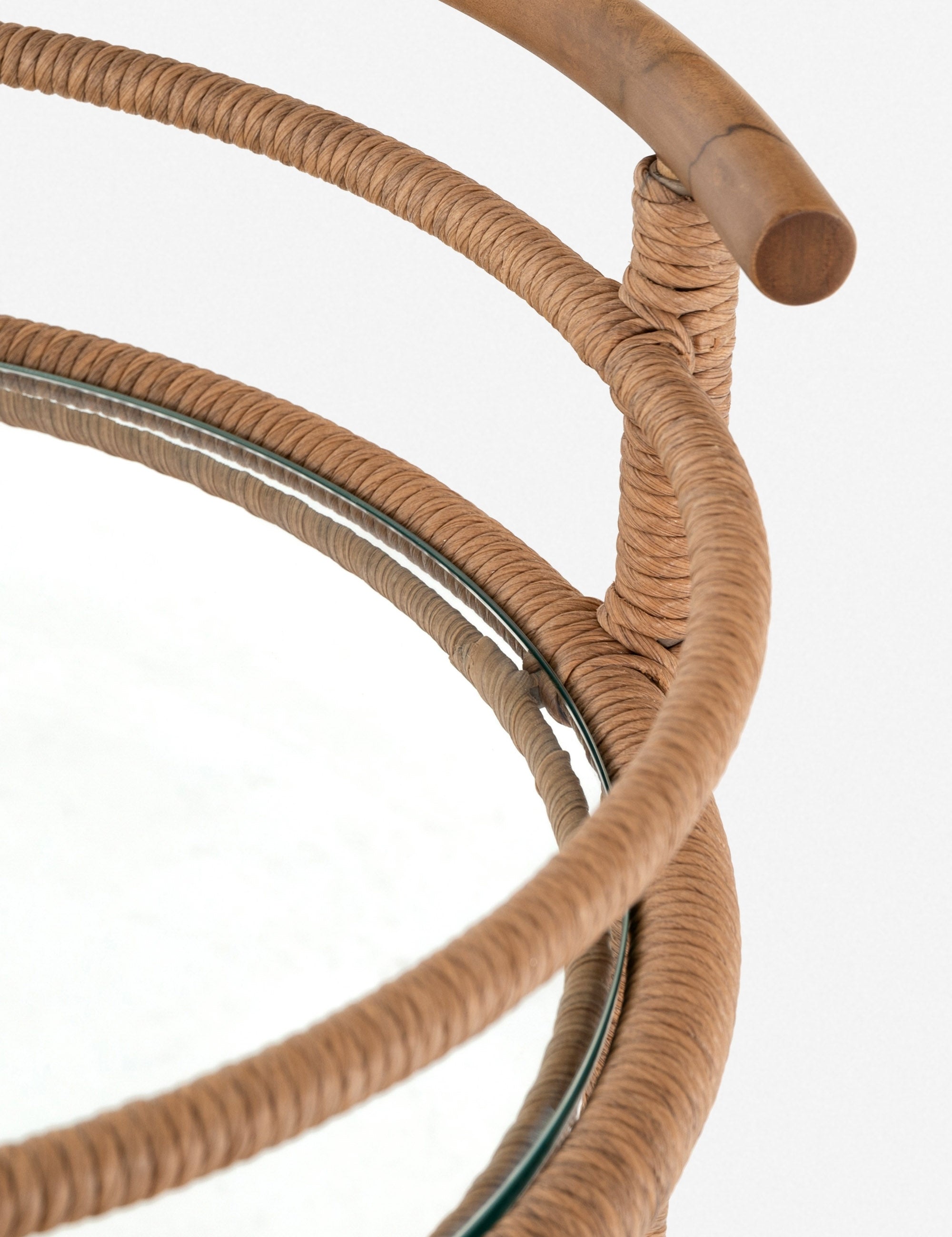 Close up of the Annika round teak rolling outdoor bar cart.