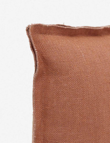 #color::rust #style::lumbar #fill type::with-feather-down-insert #fill type::pillow-cover-only | Corner of the arlo rust orange lumbar pillow