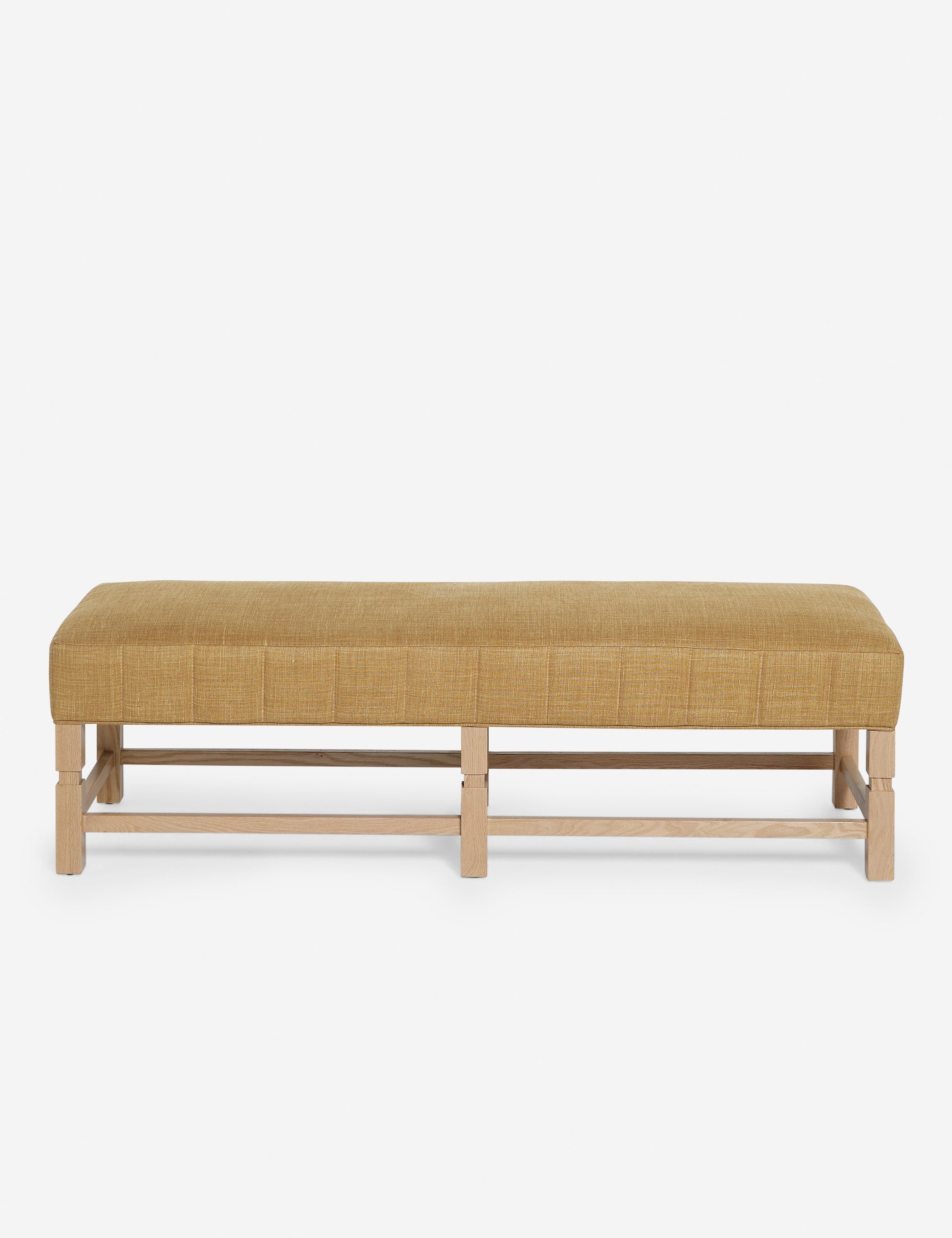 Ambleside Camel Linen upholstered bench with carved detailing on the frame and vertical channeling around the cushion by Ginny Macdonald