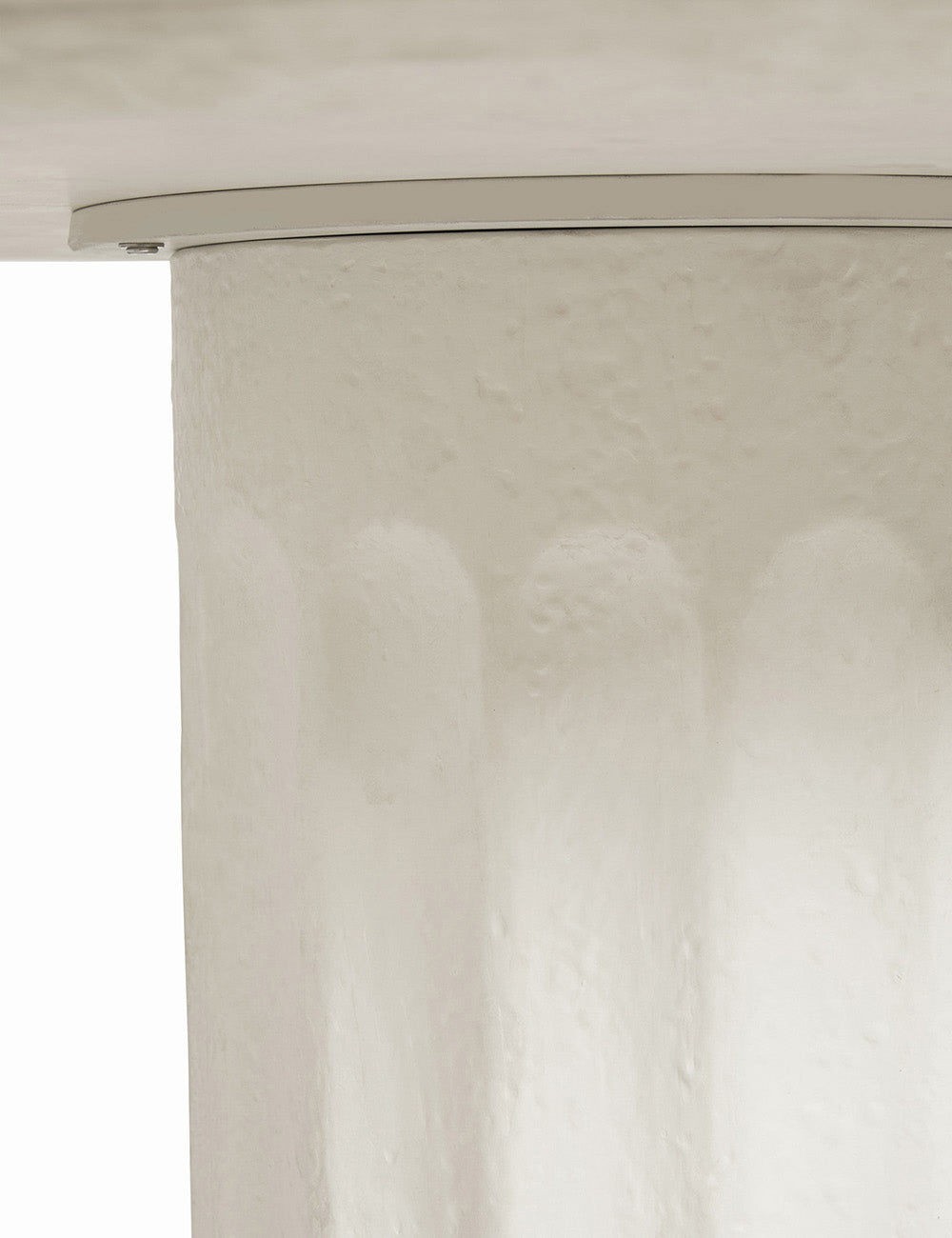 The underside of the Doric white round dining table where the column base and top connect