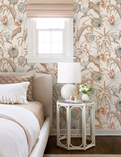 #color::natural | Natural-toned Tropical Wallpaper by Rylee + Cru is in a bedroom with a linen framed bed and a glass hexagonal nightstand