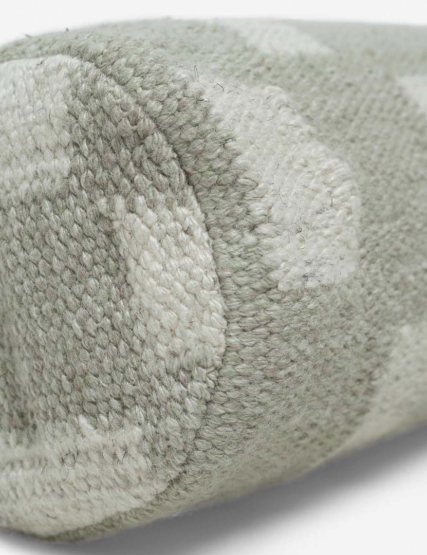 #color::khaki | Angled close up of the Irregular khaki green and white Checkerboard Bolster Pillow by Sarah Sherman Samuel